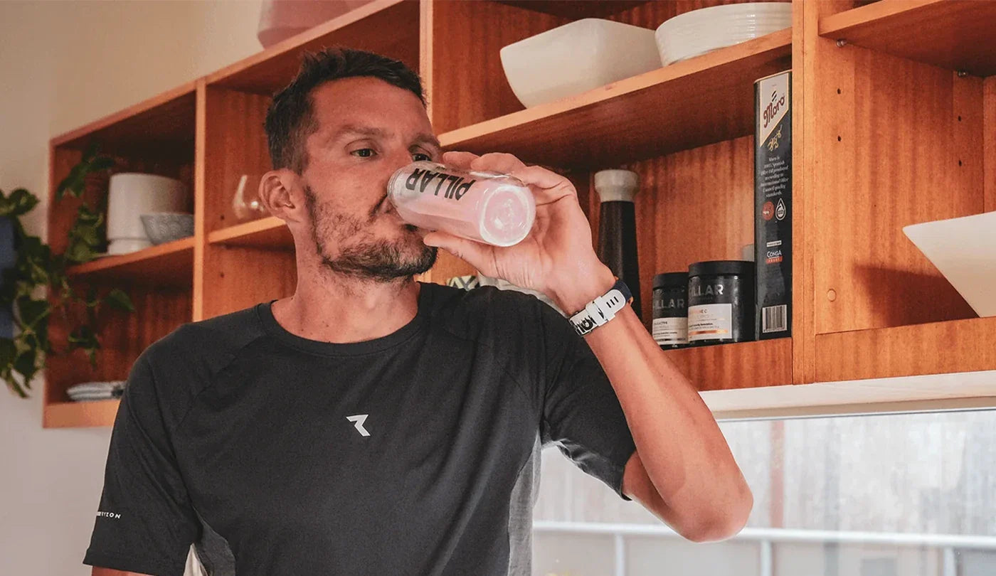 Pillar Performance Male Athlete Drinking from Bottle