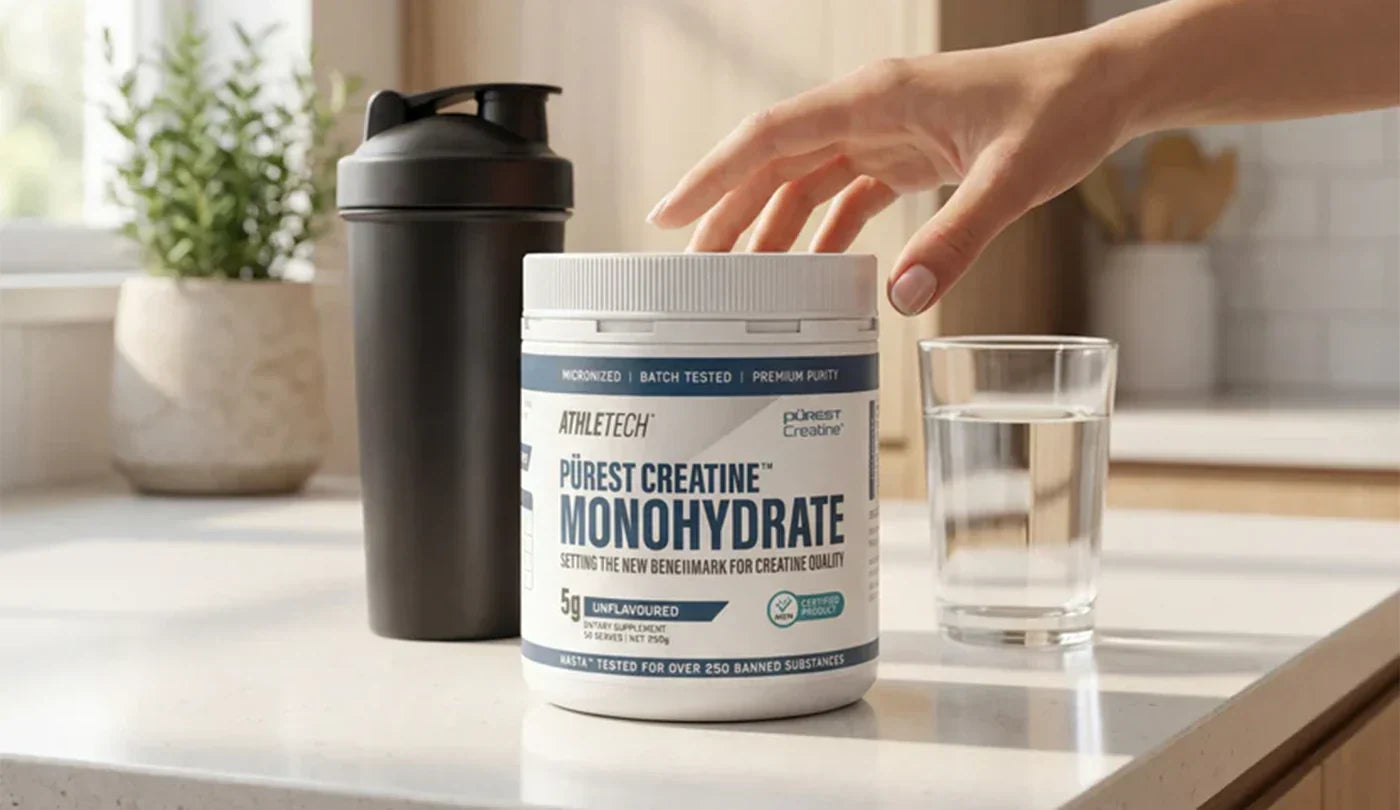 AthleTech Purest Creatine Monohydrate sitting on kitchen bench with Shaker