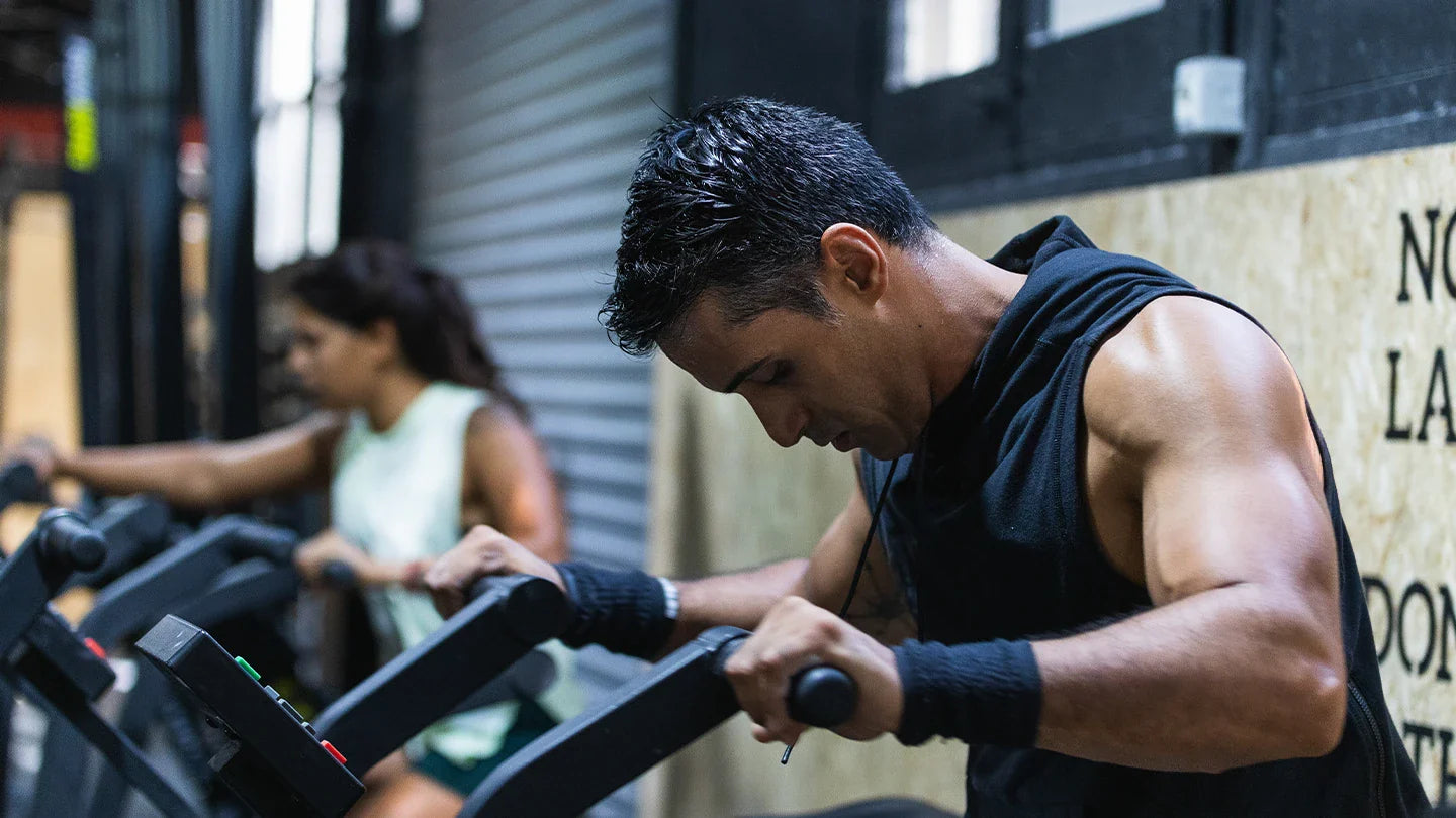 Cross fit athletes on air bike