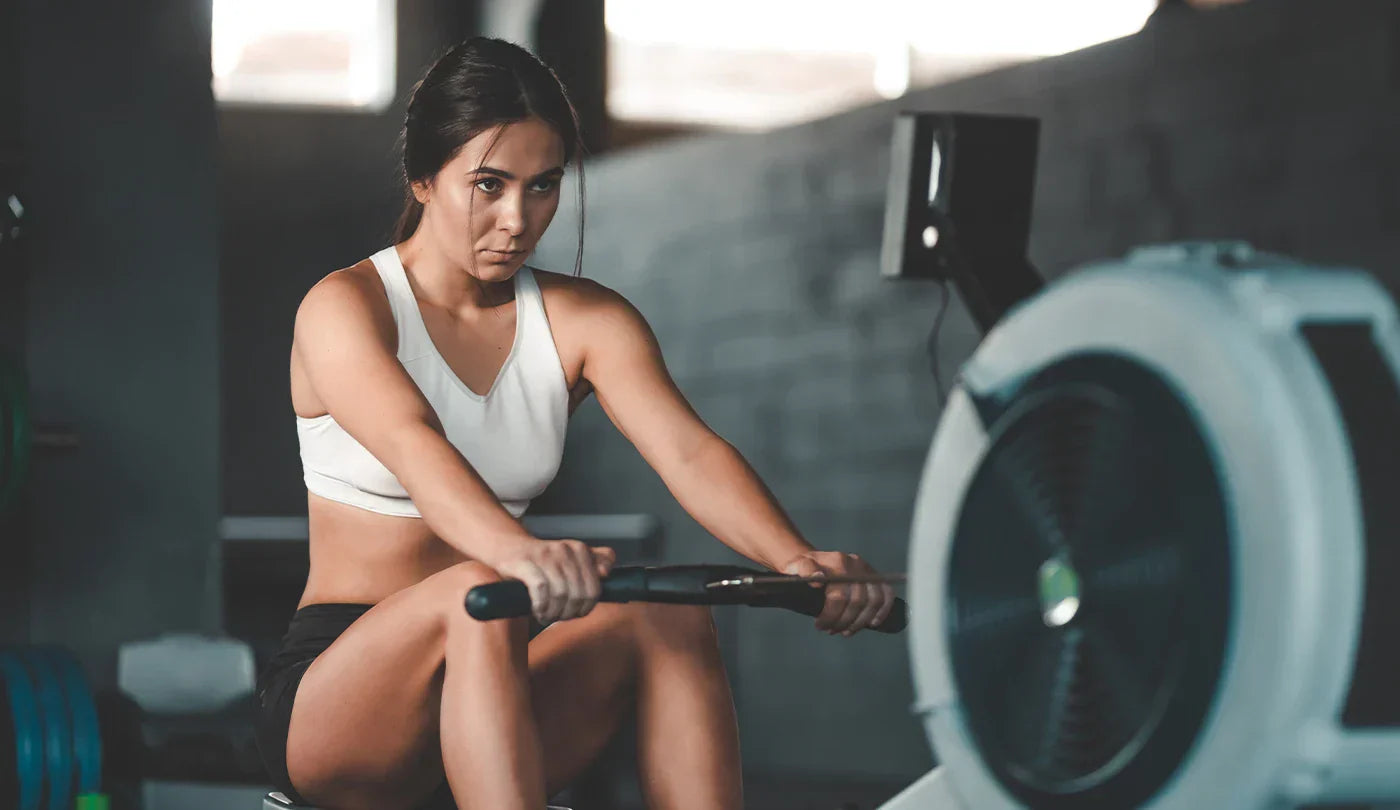 Female Athlete – Exercising on Rowing Machine