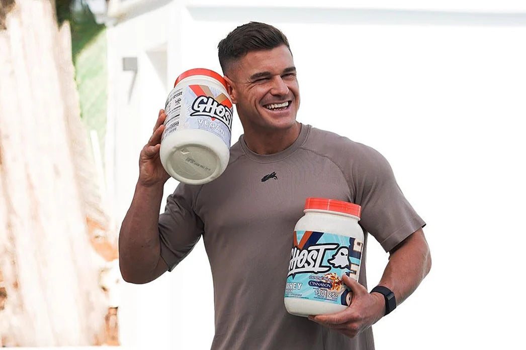 Ghost Athlete Holding Whey & Vegan Protein Powder