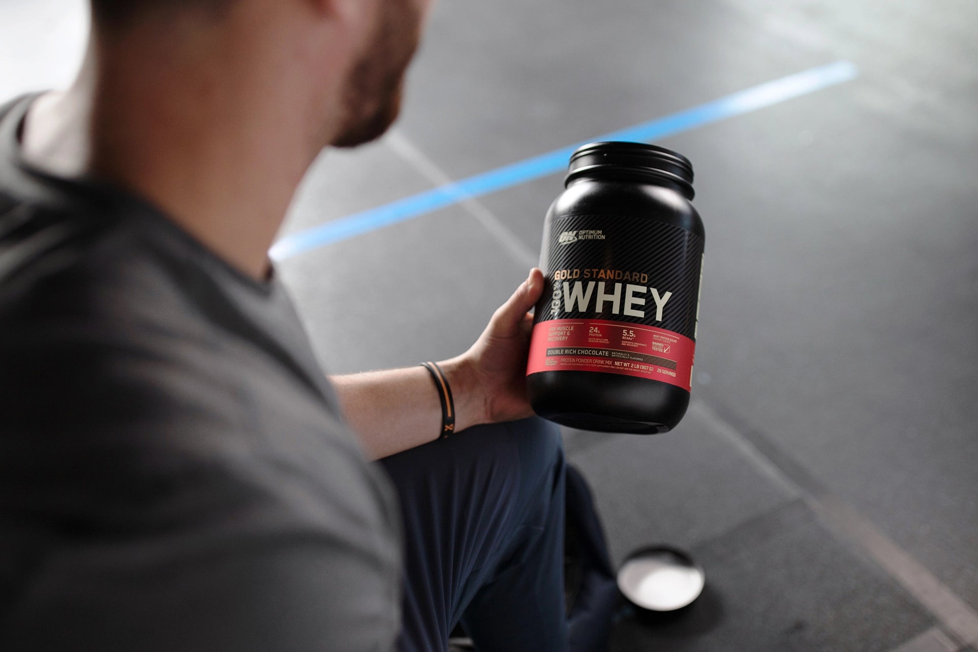 Guy Holding Gold Standard Whey