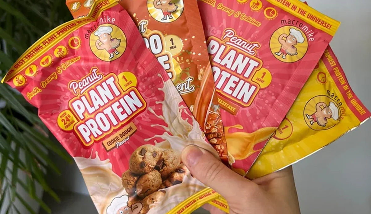 Person holding a handful of Macro Mike Plant Protein Single Serves