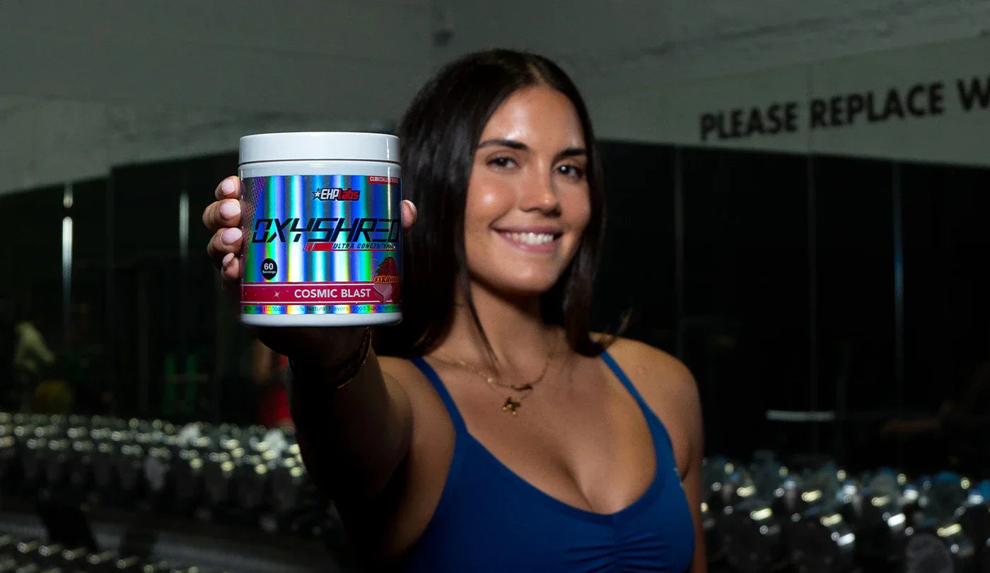 EHP Labs Athlete holding OxyShred Cosmic Blast at Gym