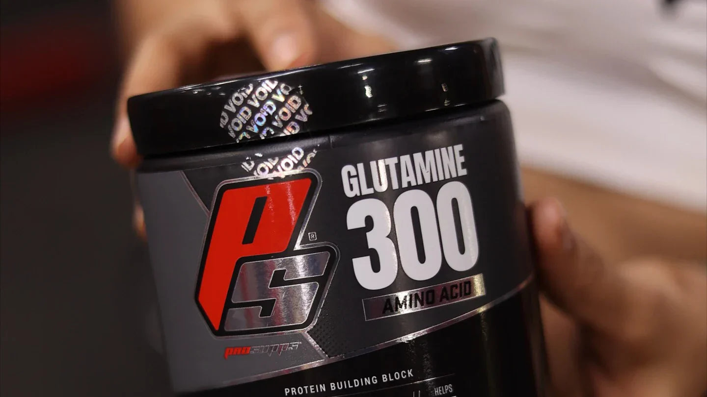Person holding ProSupps Glutamine 300 Tub