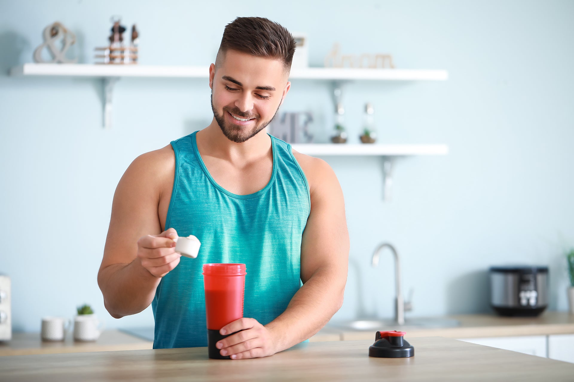 Sporty Guy Making Protein Shake