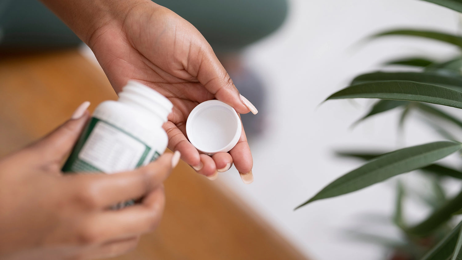Woman holding an open pill container