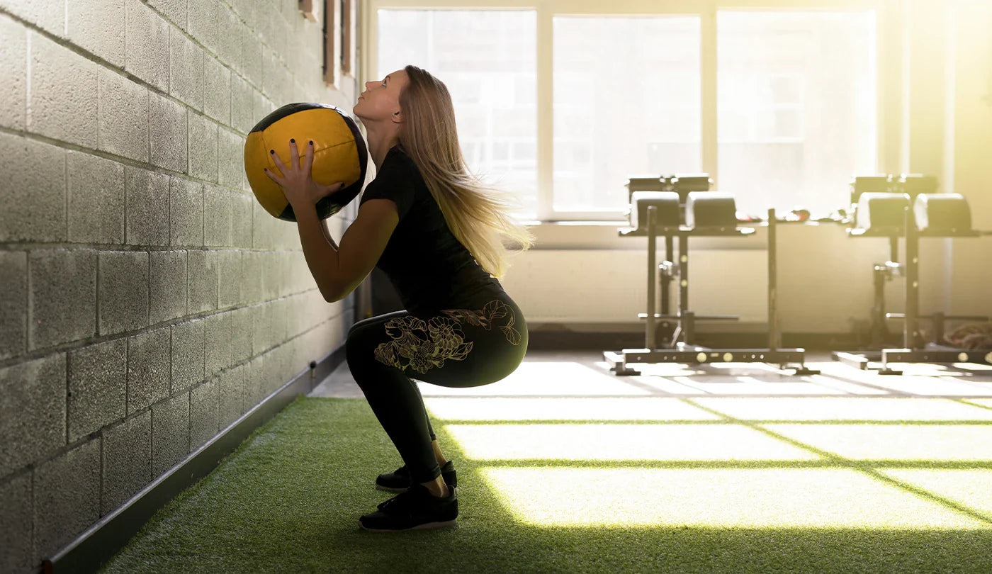 Woman doing Wall Balls at Gym