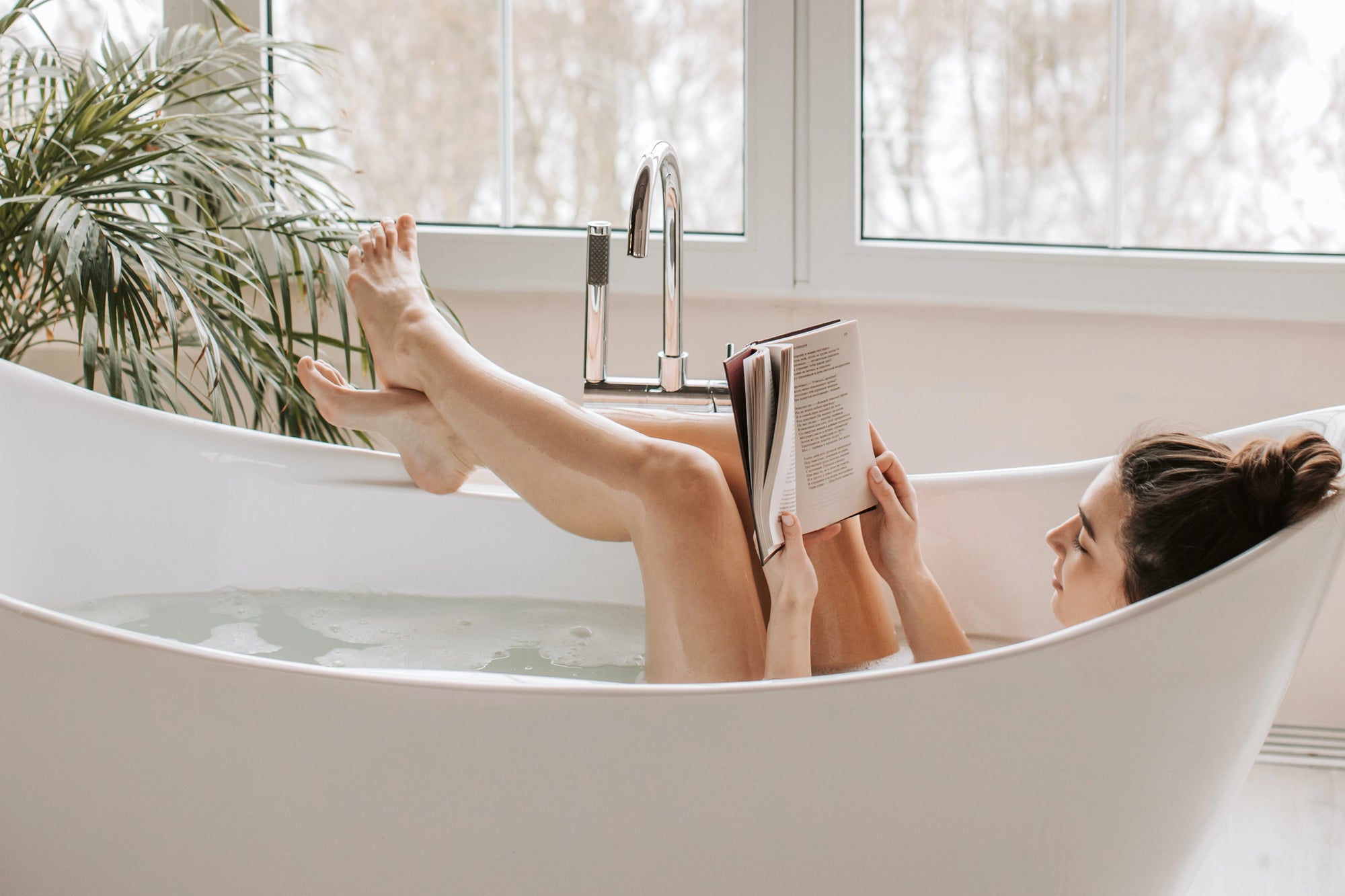 Woman Reading In Bath