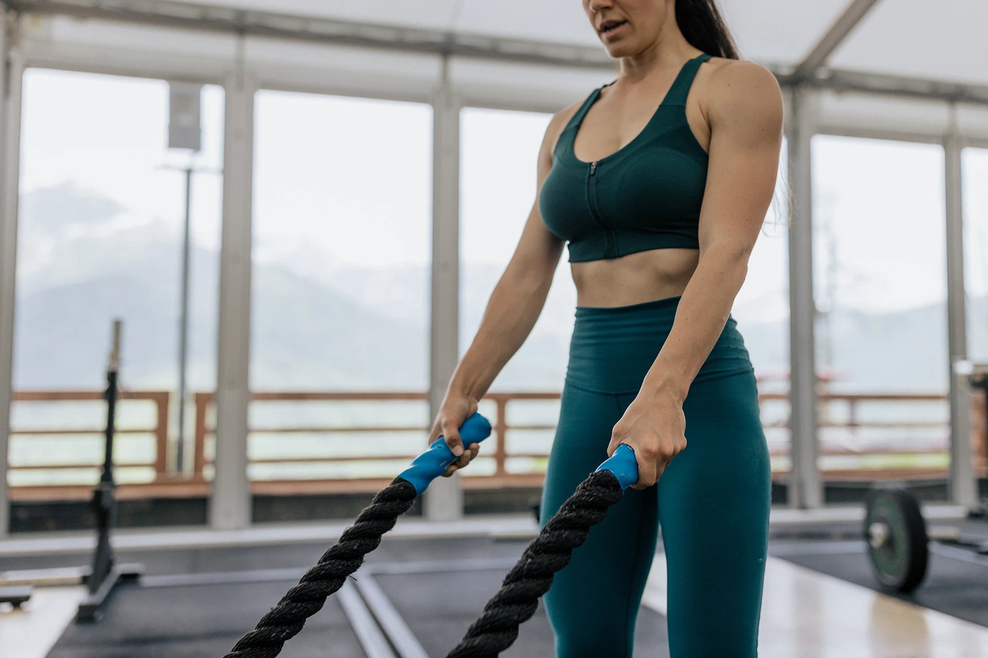 Woman doing battle ropes